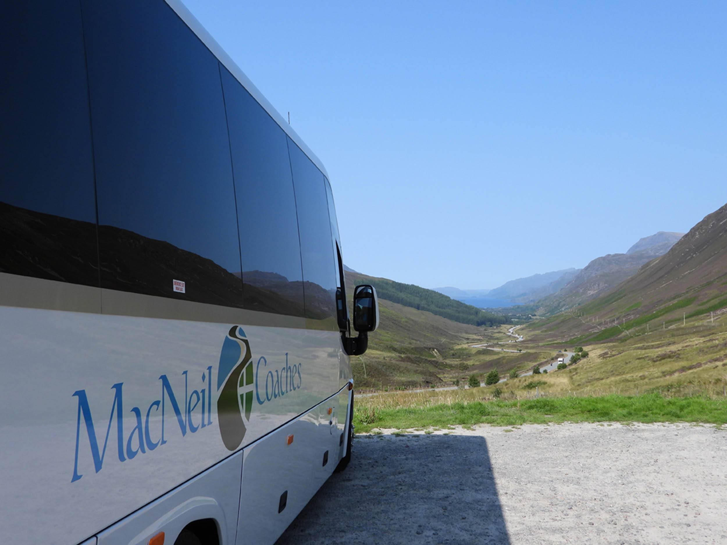 macNeil Coaches Bus parked to view Scottish Landscape